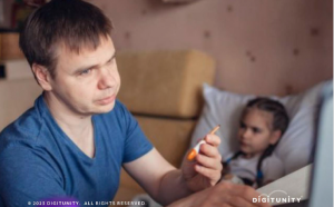 Father with sick daughter using a computer to see doctor